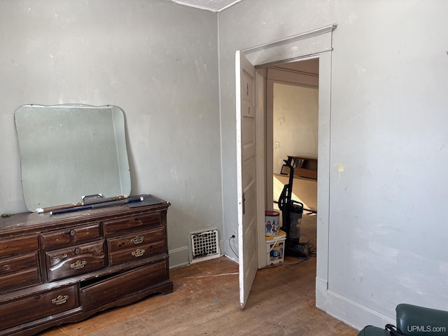 bedroom with light wood-type flooring