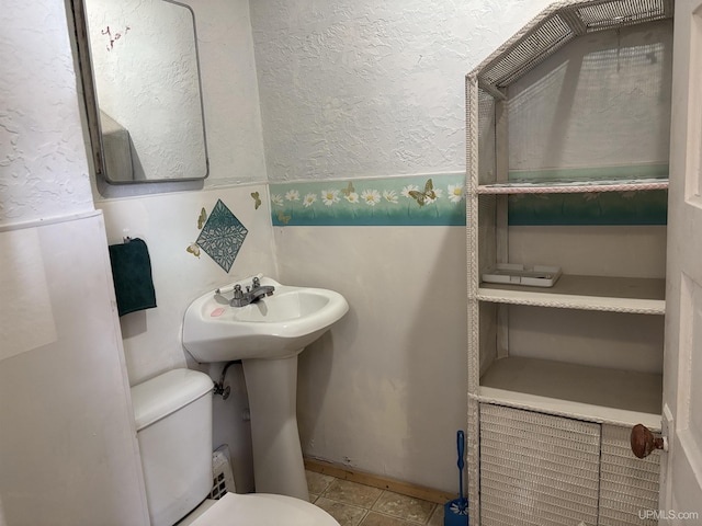 bathroom featuring toilet