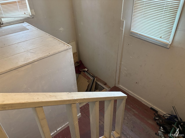 stairs featuring wood-type flooring