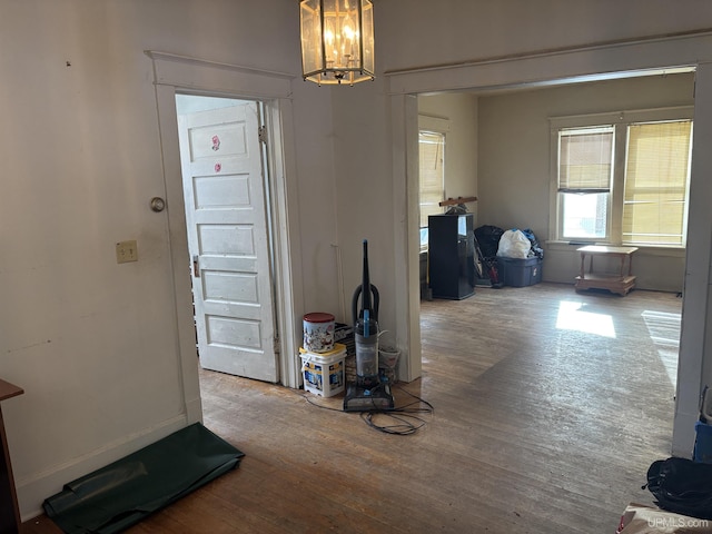 foyer featuring hardwood / wood-style flooring and a chandelier