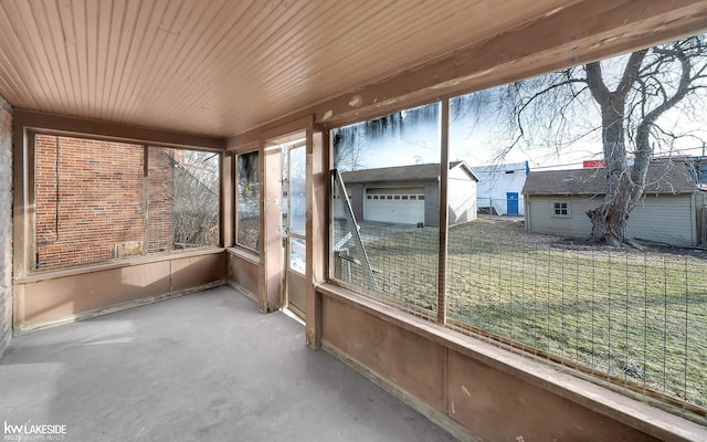 unfurnished sunroom with wooden ceiling