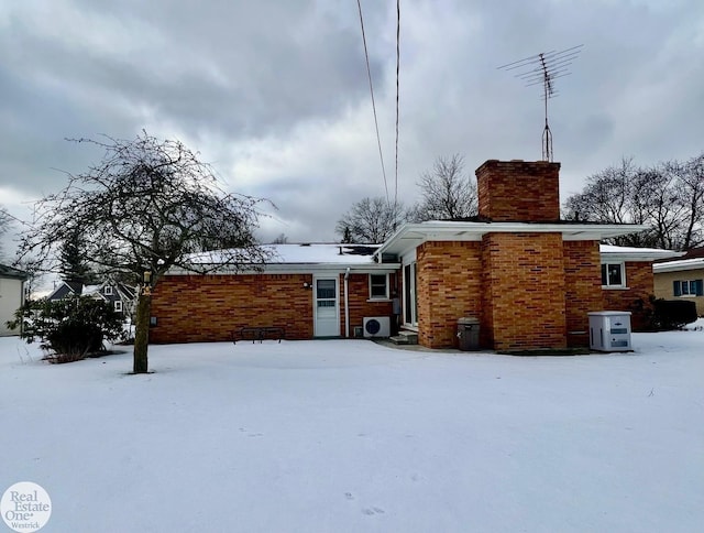 view of snow covered house