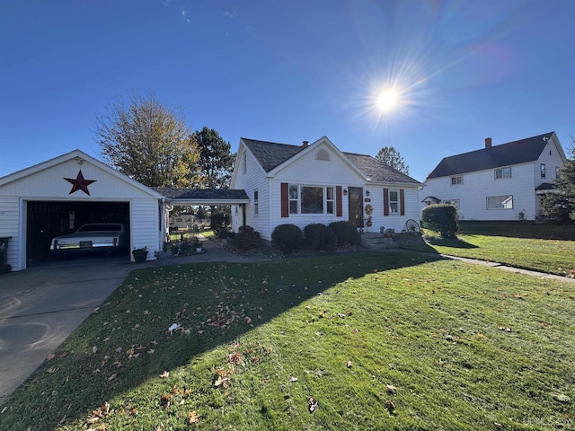 view of front of property featuring a garage, an outdoor structure, and a front yard