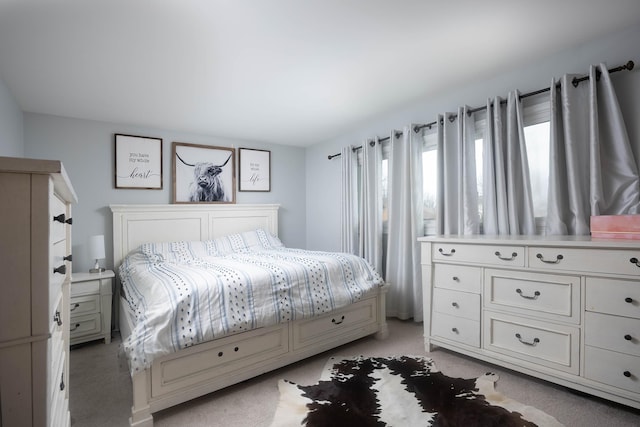 bedroom with light colored carpet