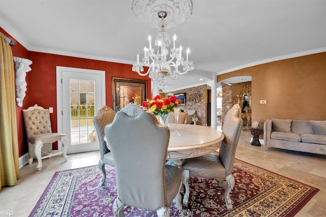 dining area featuring crown molding, an inviting chandelier, light tile patterned floors, and ornate columns