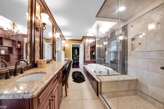 bathroom with tile patterned flooring, vanity, a notable chandelier, ornamental molding, and shower with separate bathtub