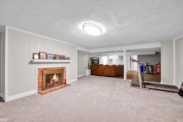 bedroom with a fireplace, a textured ceiling, and carpet