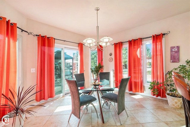 dining room featuring a wealth of natural light and a chandelier