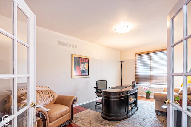 office space featuring french doors and wood-type flooring