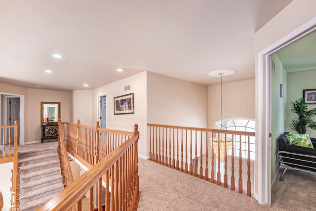 hallway with light carpet