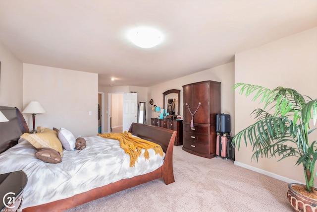 bedroom with light colored carpet