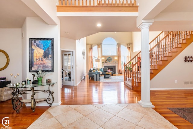 tiled foyer entrance featuring ornate columns