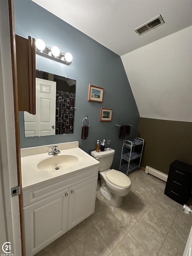 bathroom with tile patterned floors, toilet, vaulted ceiling, baseboard heating, and vanity