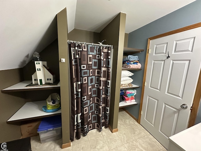 bathroom with vaulted ceiling