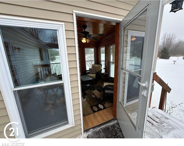 view of snow covered property entrance