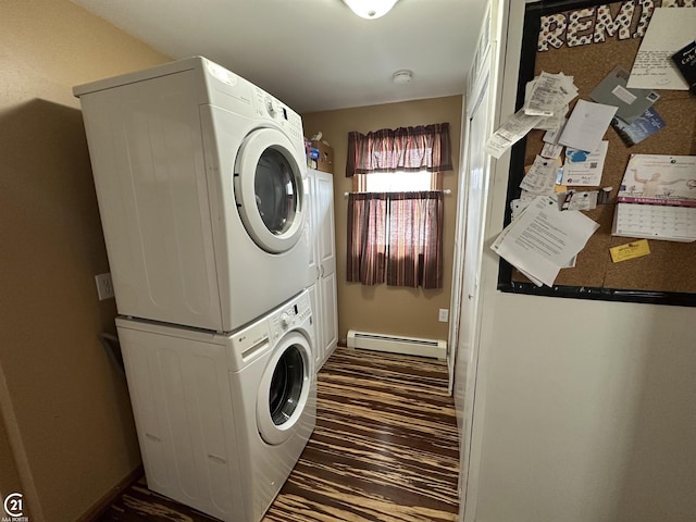 washroom featuring a baseboard radiator, stacked washing maching and dryer, and dark hardwood / wood-style flooring