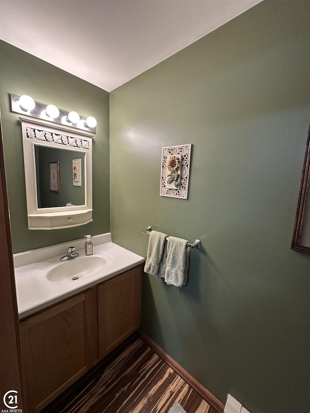 bathroom with hardwood / wood-style flooring and vanity