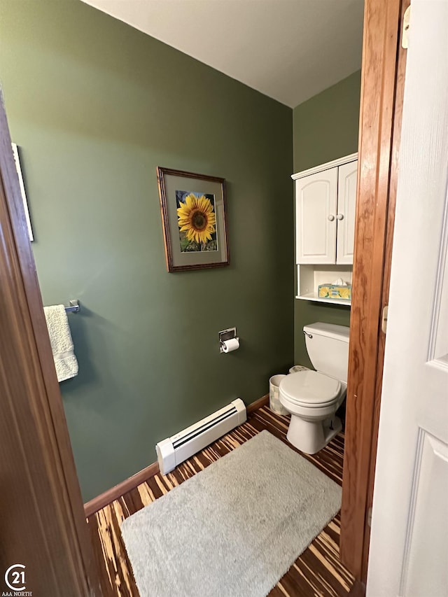 bathroom featuring a baseboard radiator, wood-type flooring, and toilet