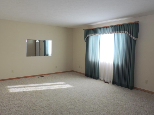 unfurnished room with carpet