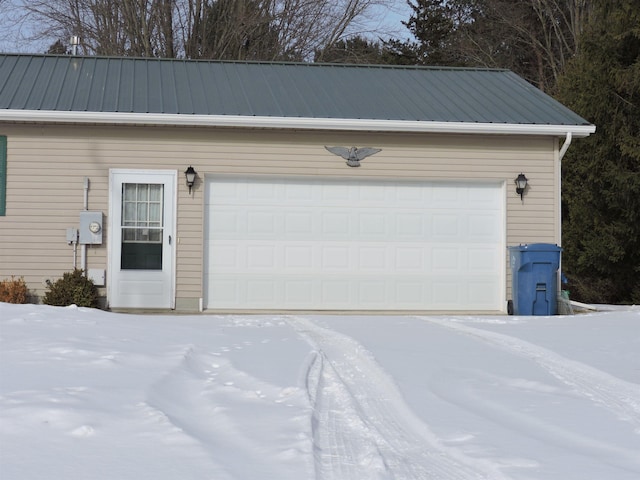 view of snow covered garage