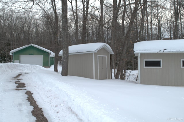 exterior space featuring a garage and a shed