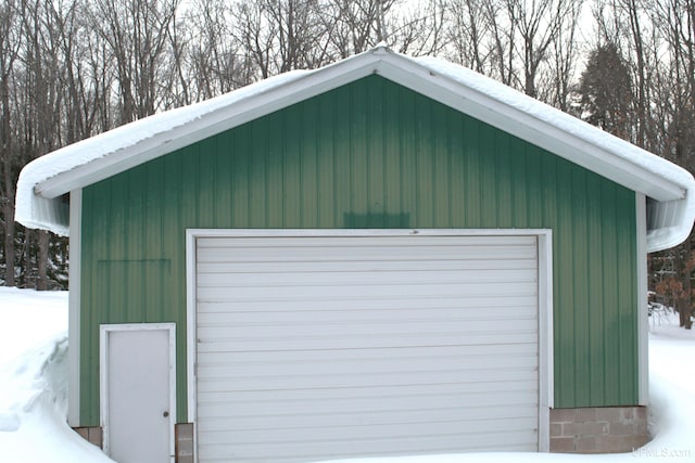 view of snow covered garage