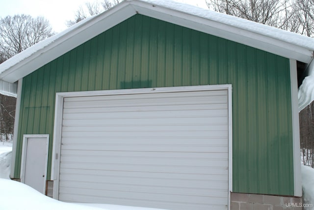 view of snow covered garage