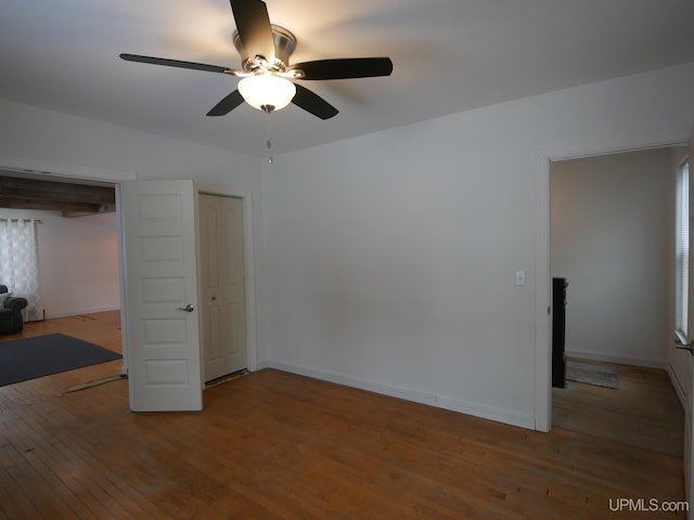 unfurnished bedroom with ceiling fan and hardwood / wood-style floors