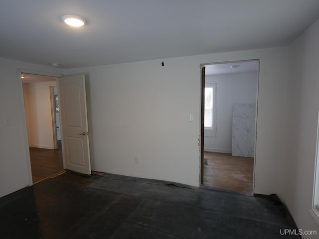 empty room featuring dark hardwood / wood-style flooring