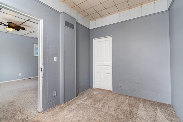 unfurnished bedroom with light colored carpet