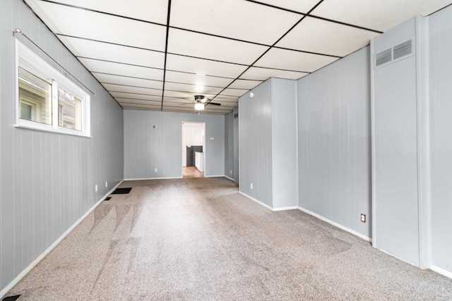 basement with carpet floors and a drop ceiling