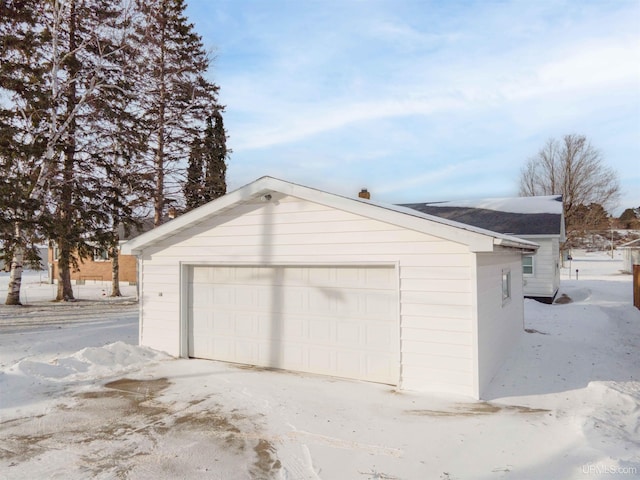 view of snow covered garage