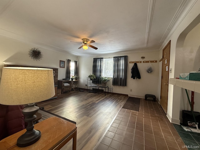 living room featuring crown molding, ceiling fan, and dark hardwood / wood-style flooring