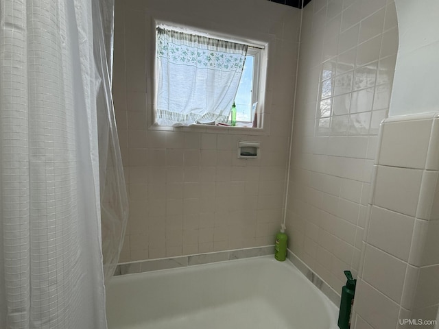 bathroom featuring shower / bath combination with curtain