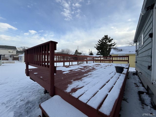 view of snow covered deck