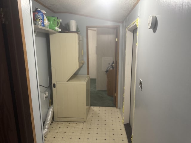 laundry area with a textured ceiling