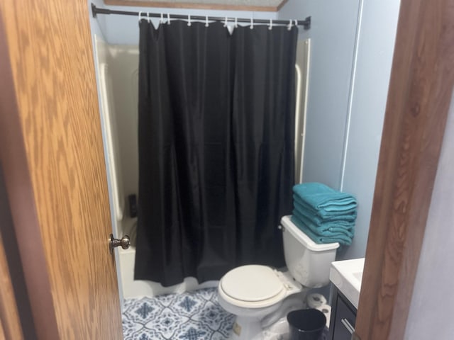 full bathroom with tile patterned flooring, vanity, shower / tub combo, and toilet