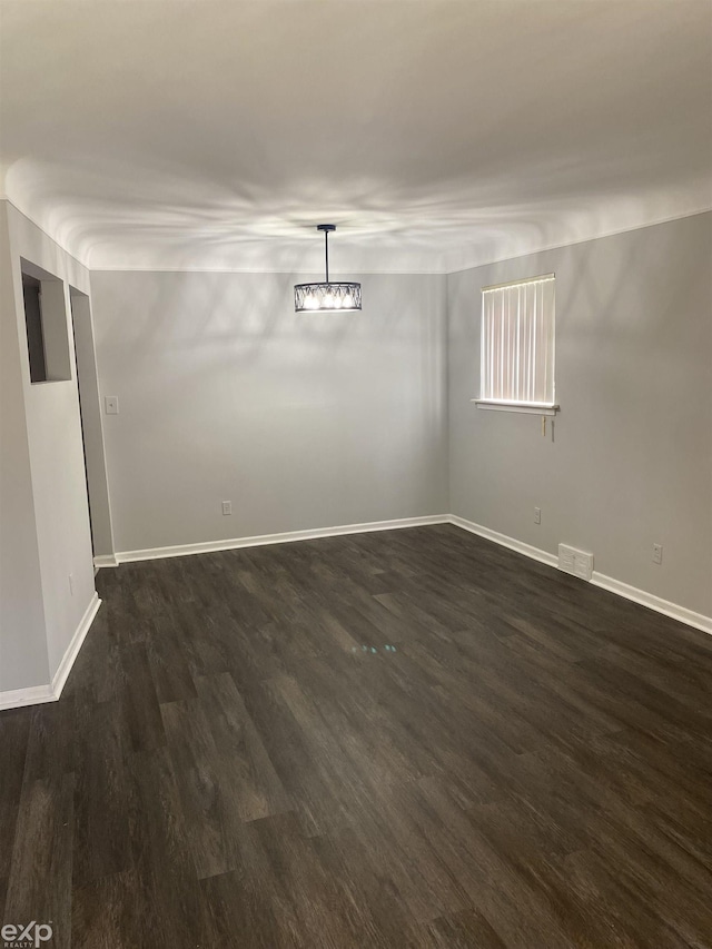 unfurnished room featuring dark hardwood / wood-style floors