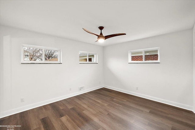 spare room with hardwood / wood-style flooring and ceiling fan