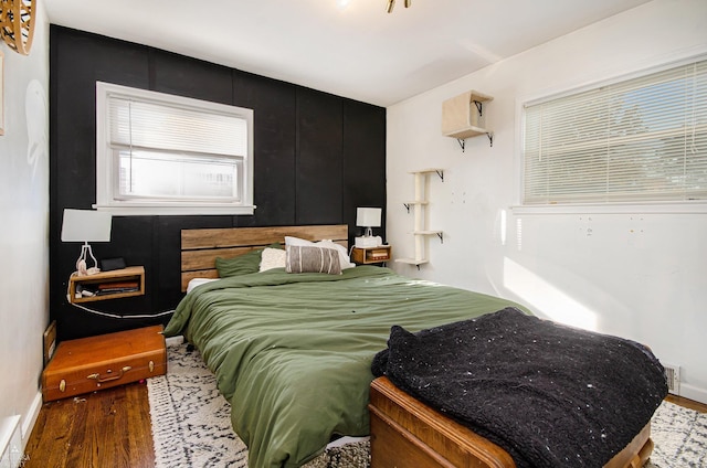 bedroom with hardwood / wood-style floors