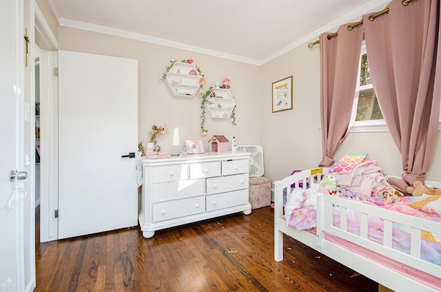 bedroom featuring crown molding and dark hardwood / wood-style floors