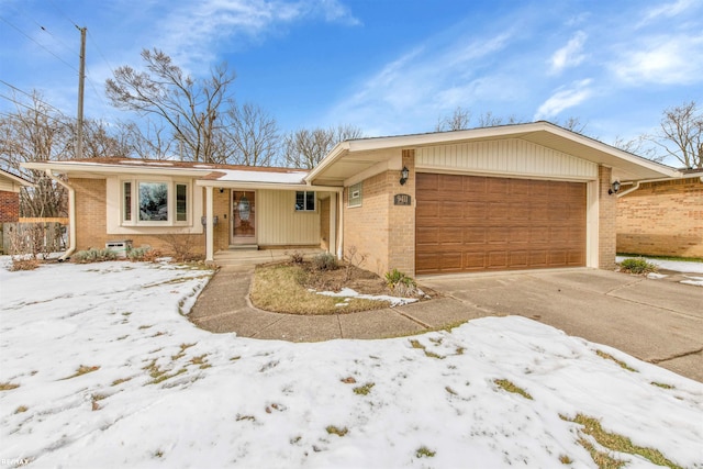 ranch-style house featuring a garage