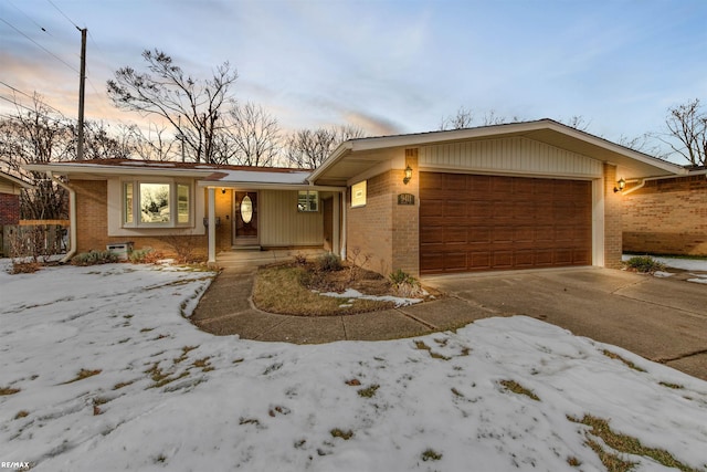 ranch-style home featuring a garage