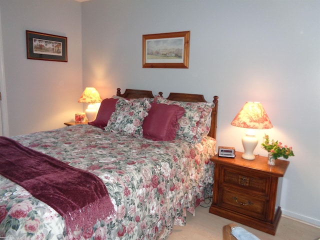 bedroom featuring light carpet