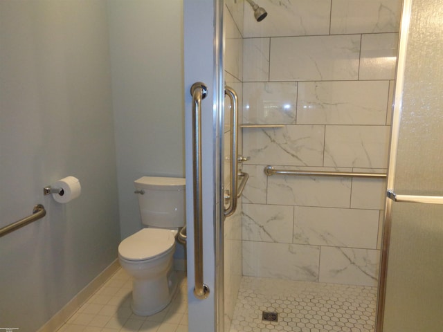 bathroom featuring an enclosed shower and toilet