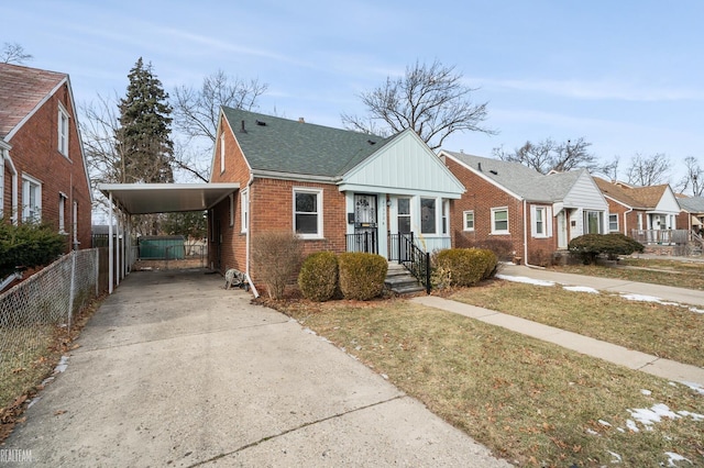 bungalow-style home featuring a carport and a front yard