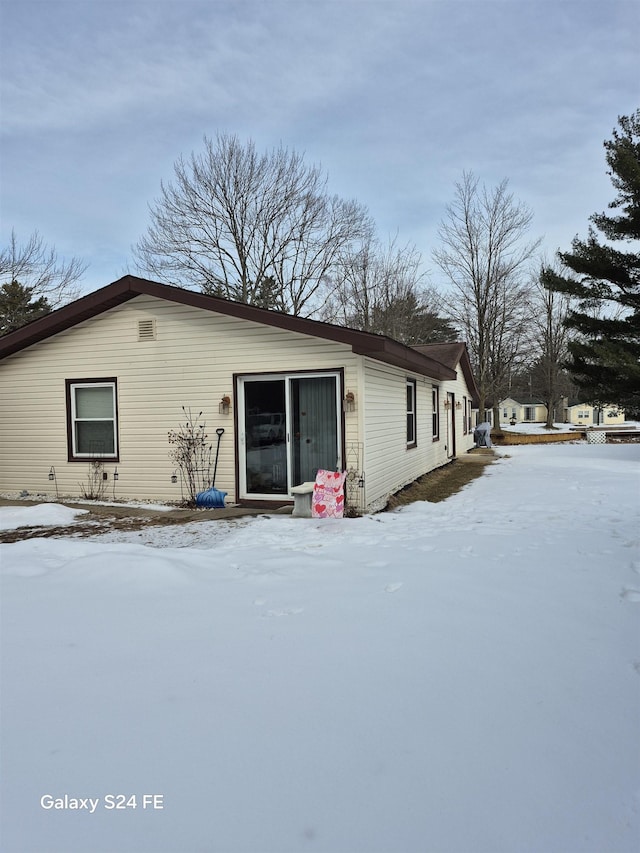 view of snow covered property