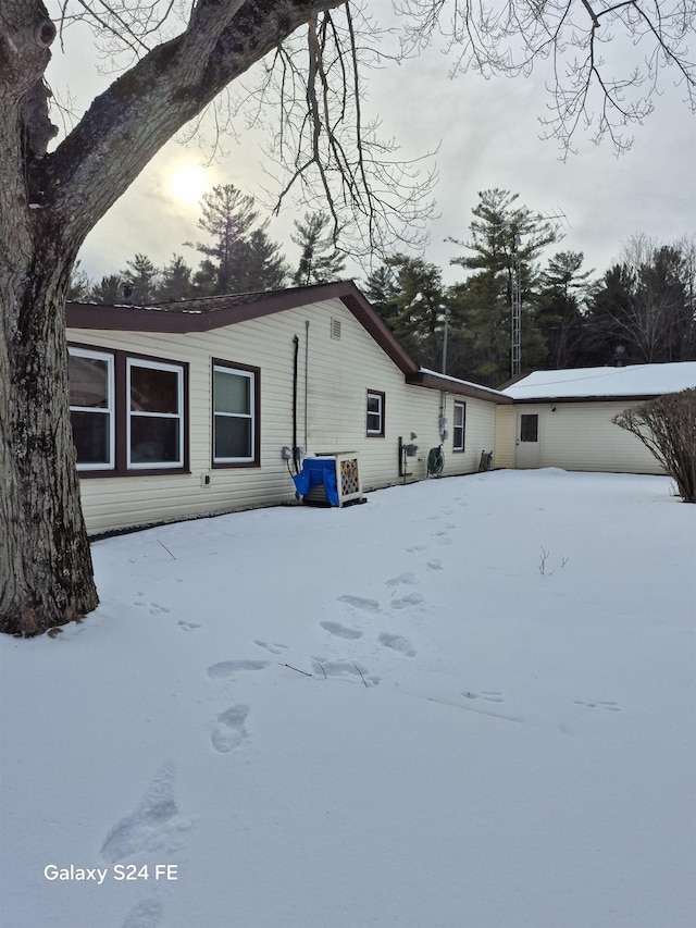 view of snow covered house