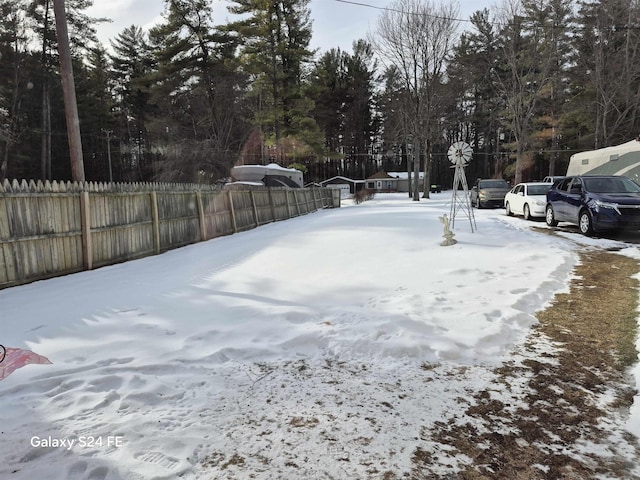 view of yard layered in snow