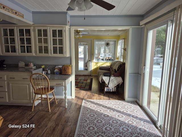 interior space with crown molding, ceiling fan, wood ceiling, and dark hardwood / wood-style floors